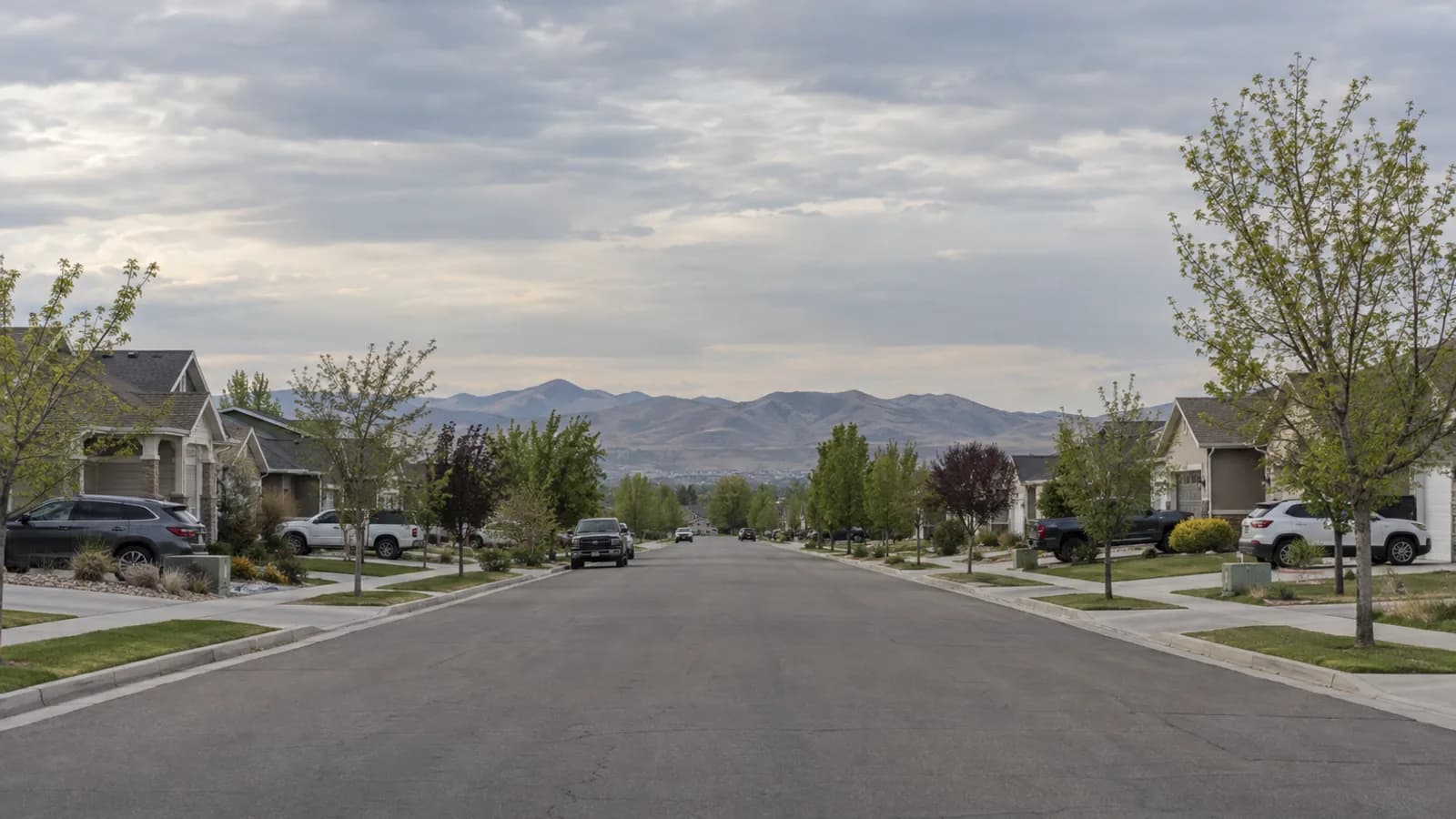 flat west-side residential grid with the Oquirrh range low on the western horizon